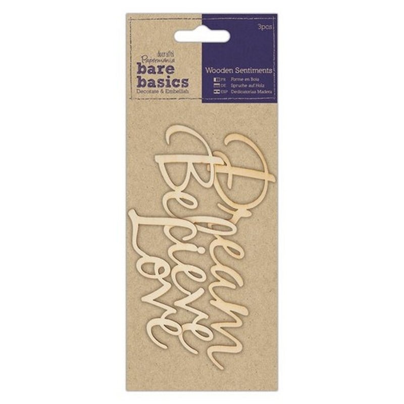 The Printable Heaven Wooden Sentiments (3pcs) - Dream Believe Love (PMA 174688) from Bare Basics features laser-cut plywood words in a script font, vertically arranged and simply packaged against a kraft paper background.