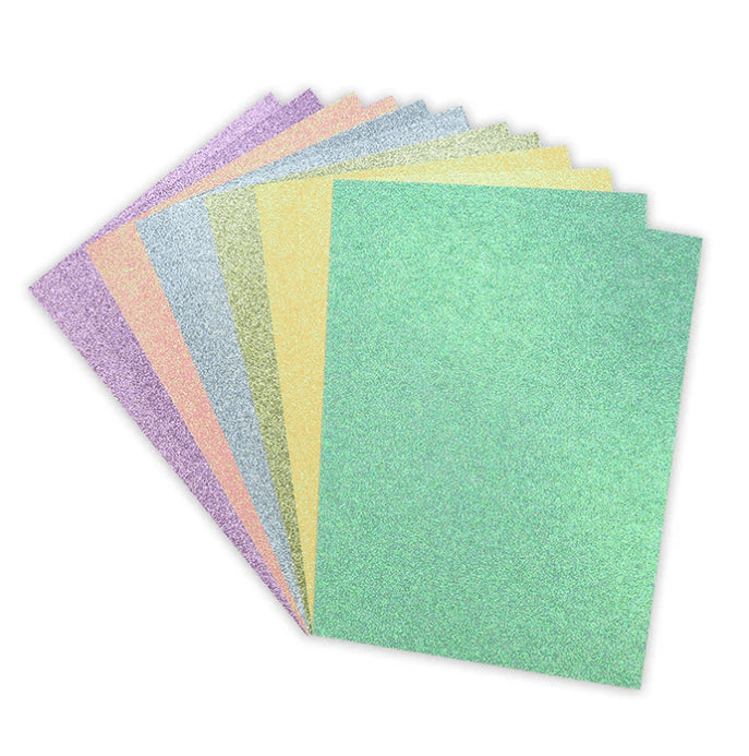 A fan of eight pastel Dovecraft A4 double-sided glitter cardstock sheets from Printable Heaven’s Rainbow Pastels Bumper Pack (12 sheets, 350gsm) is displayed against a white background.