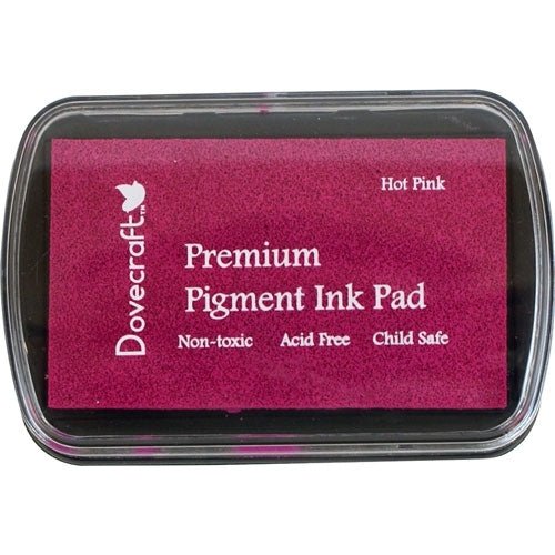 The Printable Heaven Dovecraft Pigment Ink Pad - Hot Pink (DCIP05) is a rectangular, non-toxic, acid-free, child-safe stamping pad with a clear plastic lid and white text on a hot pink background—perfect for stamping and embossing.