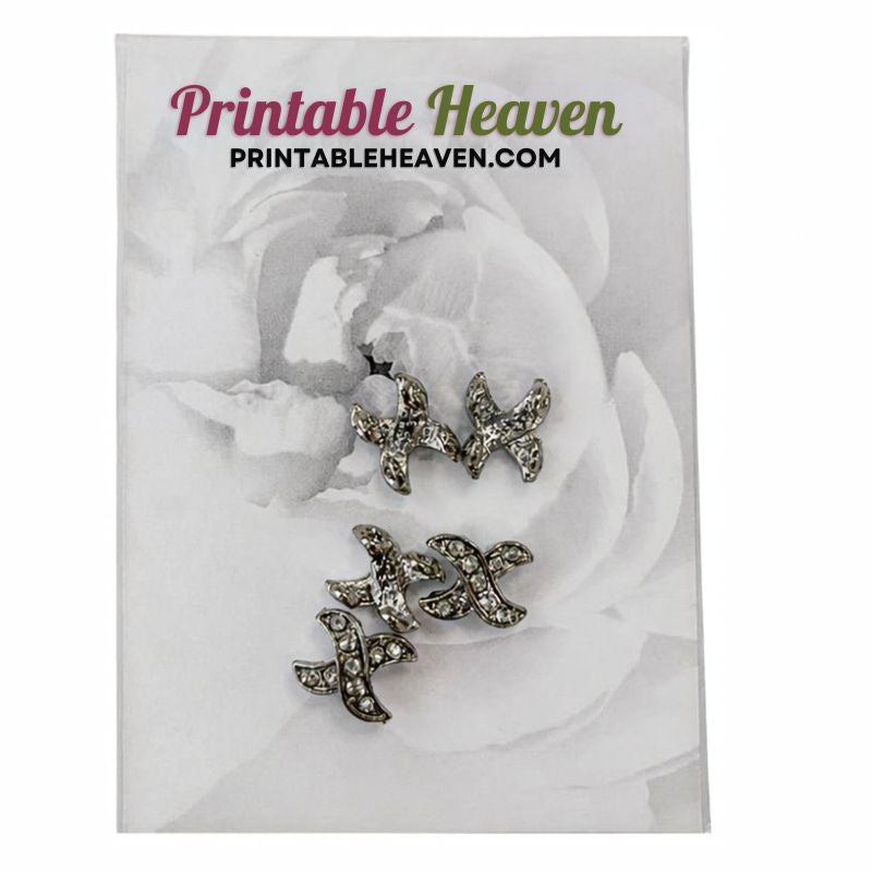 Four silver-toned Silver Studded Buttons (5pcs) shaped like crosses, each set with small clear stones, displayed on a backing card.
