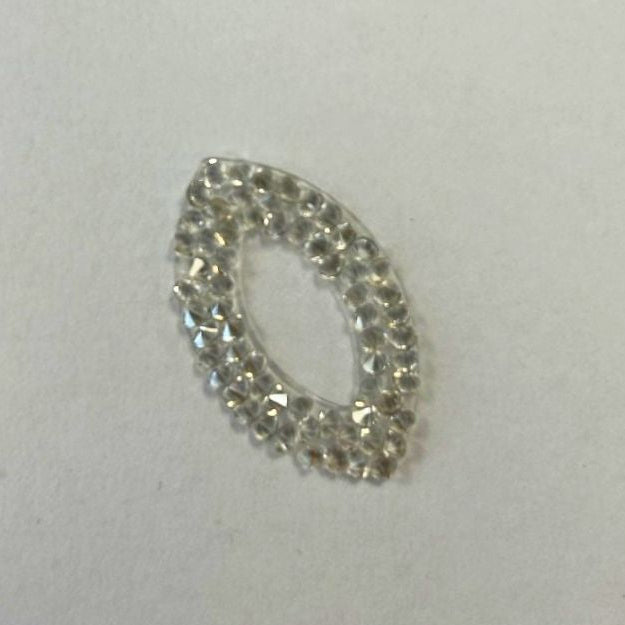A Swarovski Self-Adhesive Pearlescent Teardrop in Silvershade, a teardrop-shaped adhesive embellishment made of small, clear faceted crystals.