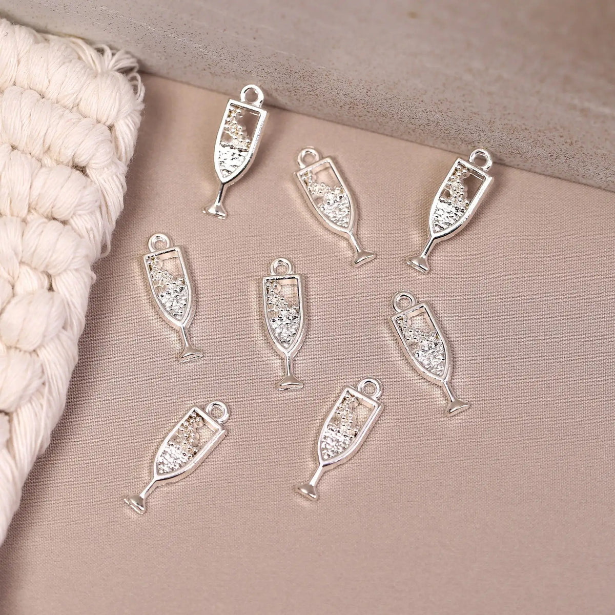 Eight Champagne Glass Metal Charms (8pcs) (MLB-110) in silver-tone with glittery accents, ideal for jewellery making.