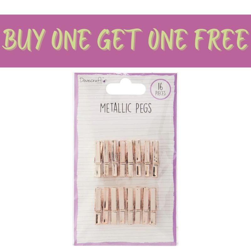 A pack of 16 Fast Bundle Dovecraft Metallic Pegs in Rose Gold (DCBS173) is shown with a bold 2 FOR 1 OFFER, featuring a light package with purple accents—ideal for scrapbooking.