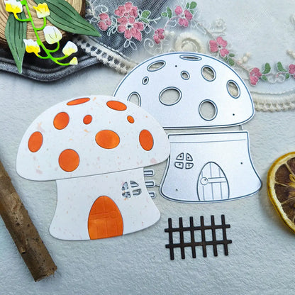Bring enchanting woodland crafts to life with the Cutting Die – Playful Mushroom House Design (3 PCS) from Printable Heaven. This set features two whimsical mushroom house die-cuts—one adorned with orange spots and a door, the other crafted as a metallic outline—that effortlessly evoke fairy-tale charm. Nearby accents like a black grid, dried orange slice, embroidered lace, and yellow flower decorations complete the magical scene.