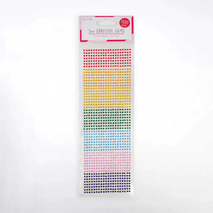 The "Love to Craft 3mm Gems - Rainbow (LCDOT037A)" includes 1080 self-adhesive gems arranged by color—red, orange, yellow, green, blue, and purple—perfect for papercraft projects. The top label reads "3mm Adhesive Gems, 1080 pcs.