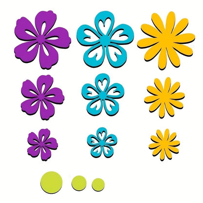 Twelve colorful and uniquely designed 3D flowers and circles from the Printable Heaven Flower Cutting Die Set (12 PCS) F045, in shades of purple, blue, yellow, and green, are artfully arranged on a white background. The varied petal shapes and sizes make this die set perfect for paper crafting or as creative inspiration.