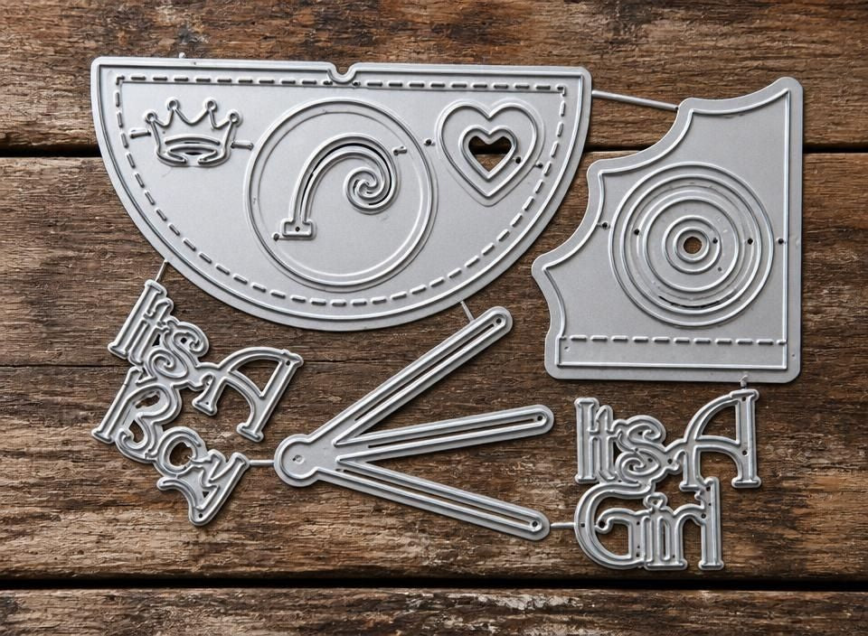 The Printable Heaven It’s a Boy / It’s a Girl Baby-Themed Cutting Die Set (10 PCS) (W091) features metal dies for phrases like “It’s A Boy” and “It’s A Girl,” alongside shapes such as a crown, heart, semi-circles, and a pram—making it ideal for new baby card making or creative crafts celebrating little ones.