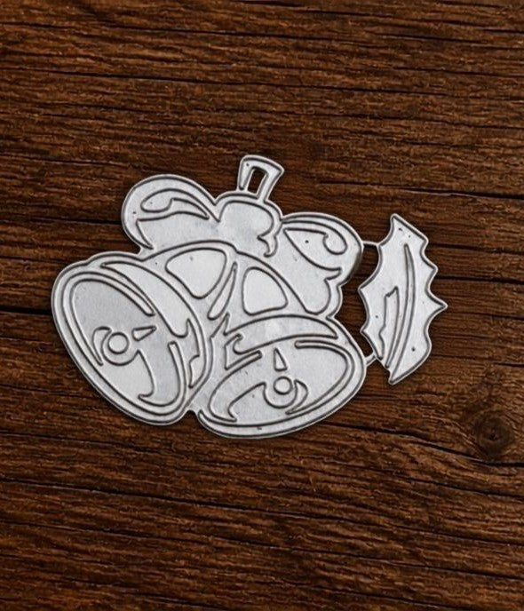 A pair of silver metal dies from Printable Heaven’s Layered Leaf Cutting Die set (2 PCS) (F115), featuring intricate leaf designs, is displayed on a wooden surface. Perfect for paper crafting, these botanical dies add elegant detail to cards and scrapbook layouts, serving as beautiful embellishments for any creative project.