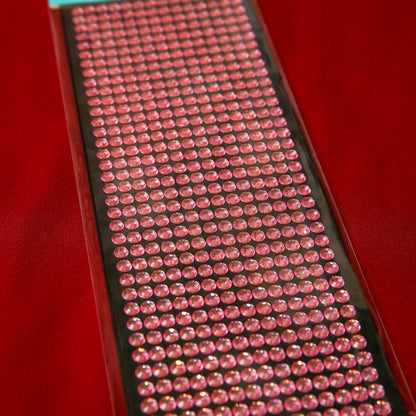 A sheet of Printable Heaven 6mm Pink Crystal Sticky Gems—small, round, self-adhesive jewels in neat rows on a black backing—makes perfect craft embellishments for any creative project.