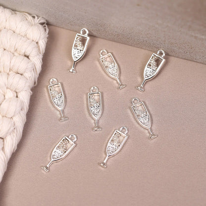 Eight Champagne Glass Metal Charms (8pcs) (MLB-110) in silver-tone with glittery accents, ideal for jewellery making.