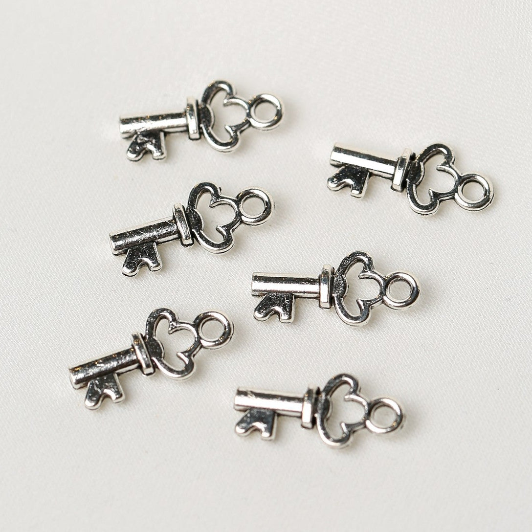 Six Key Metal Charms (6pcs) (MLB-074) consisting of small silver-toned keys with heart-shaped bows.