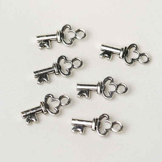 Six Key Metal Charms (6pcs) (MLB-074) consisting of small silver-toned keys with heart-shaped bows.