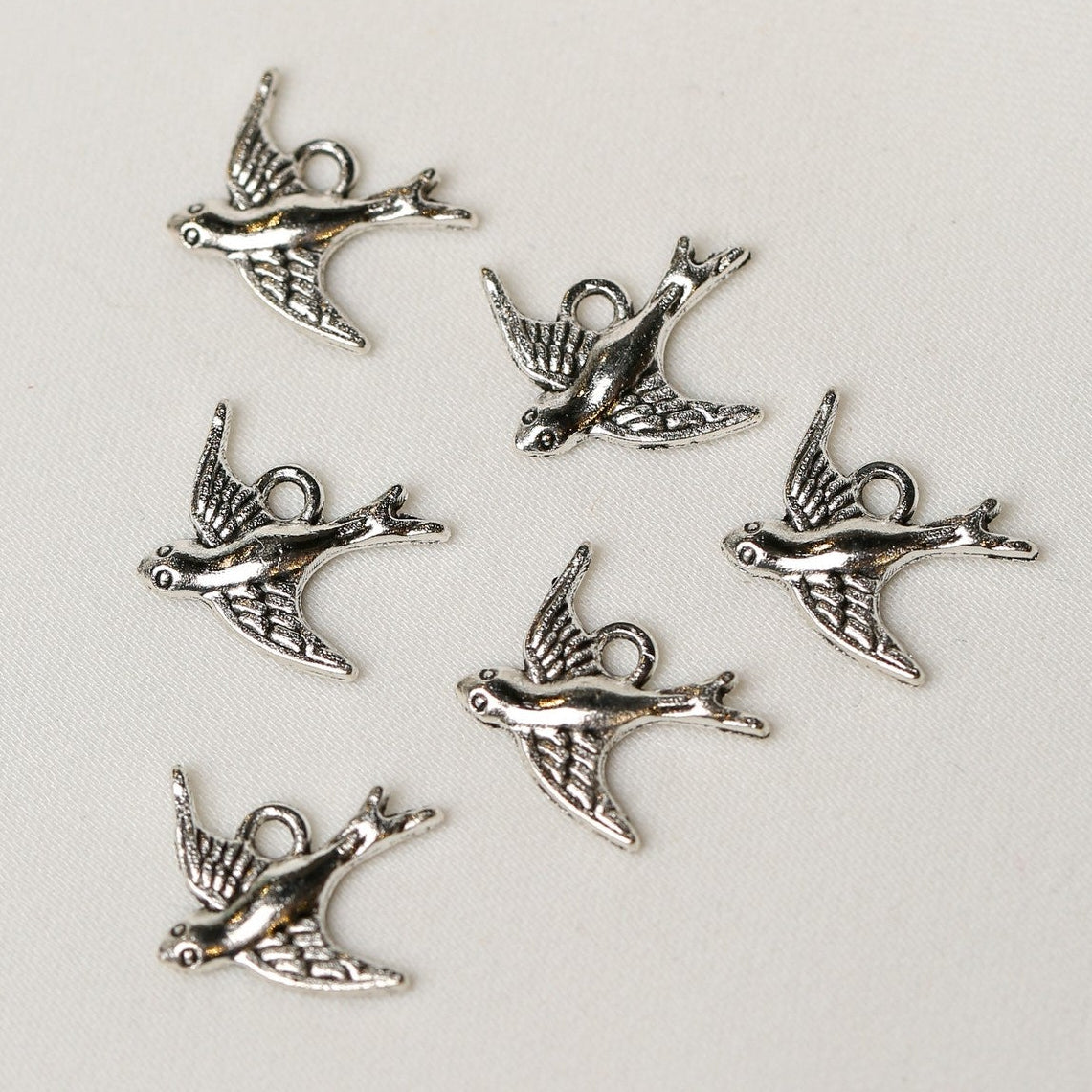 A cluster of six silver-colored metal Bird Metal Charms (6pcs) (MLB-077).