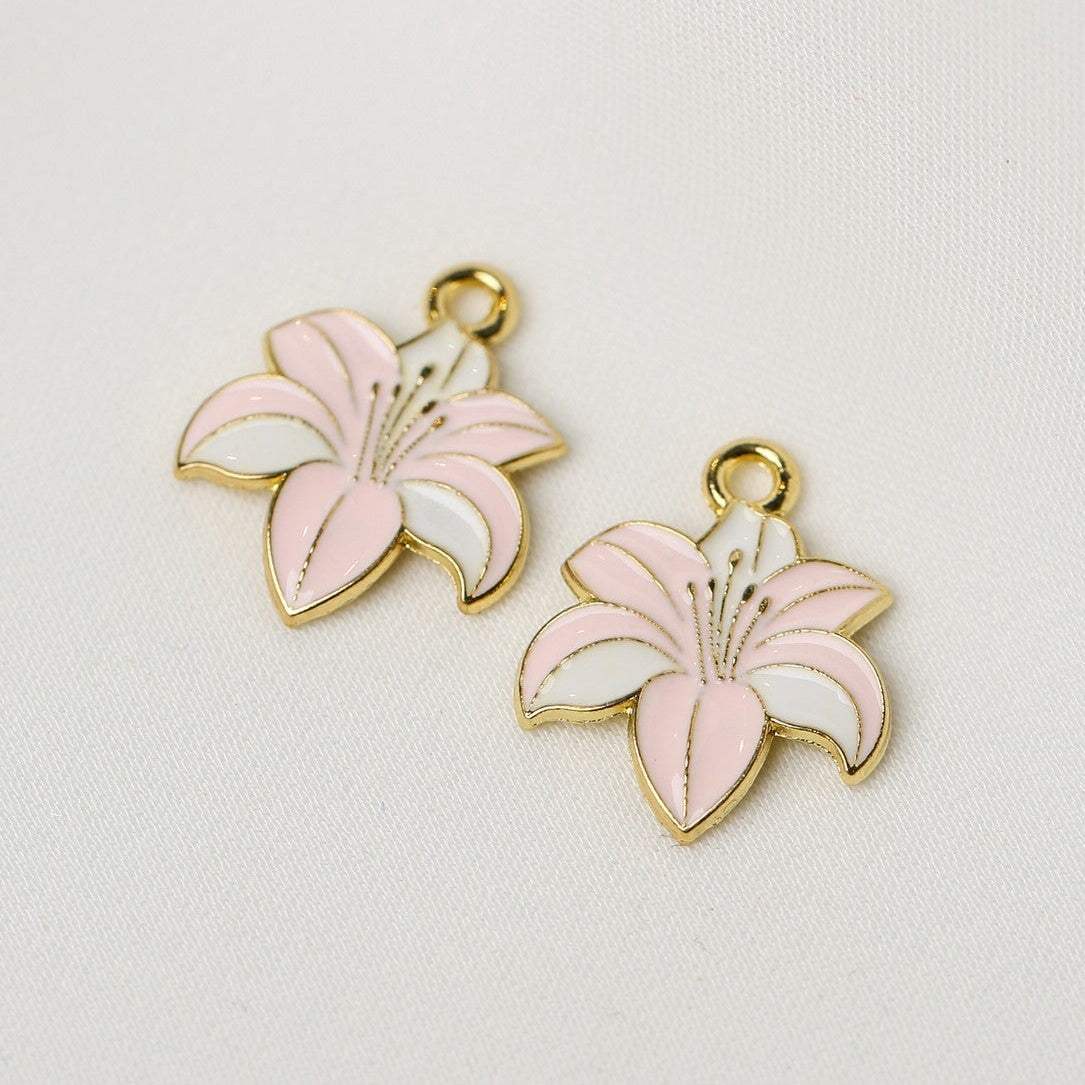 Two gold-toned Amaryllis Flower Metal Charms (2pcs) (MLB-090) with pink and white enamel petals.