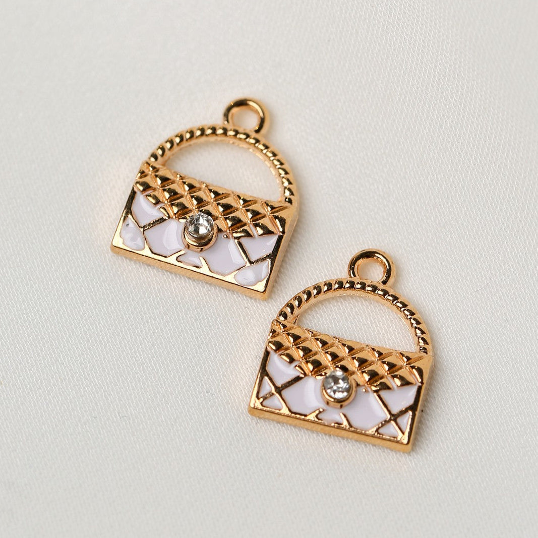 Handbag Metal Charms (2pcs) (MLB-095) featuring two gold-toned charms with white enamel inlay and a single inset crystal.