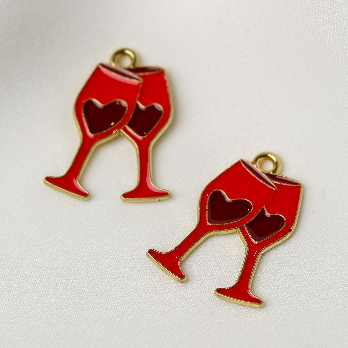 Valentine’s Wine Glass Metal Charms (2pcs) (MLB-113) shaped like two red wine glasses with heart-shaped cutouts.
