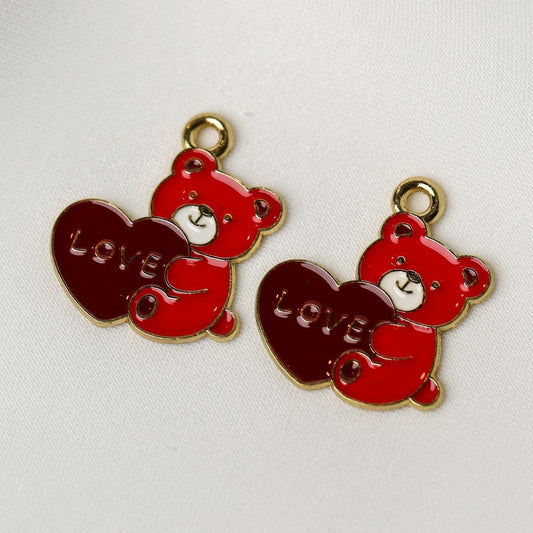 Valentine’s Teddy Bear Metal Charms (2pcs) (MLB-114): two metal teddy bear charms, each holding a red heart embossed with the word LOVE.