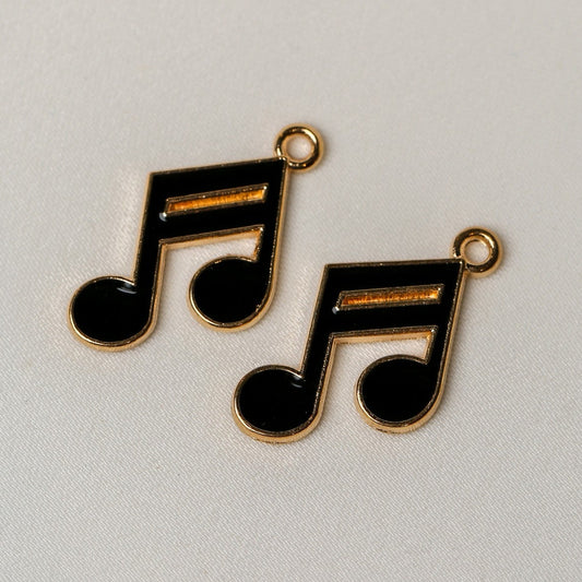 Two Semiquavers Music Note Metal Charms (2pcs) (MLB-120), featuring gold-toned music notes with black enamel fill and small loops for hanging.