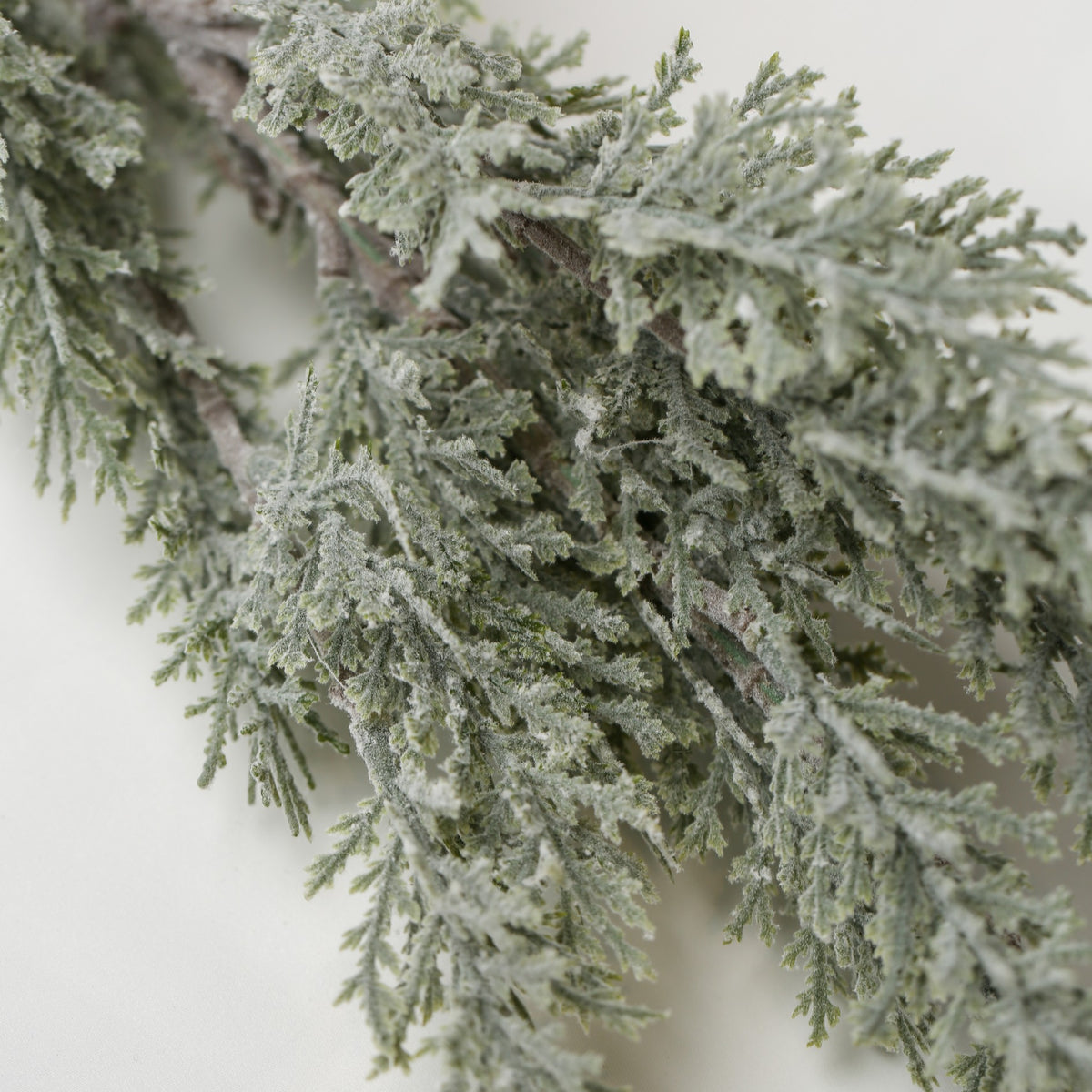 Printable Heaven Faux Frosted Leaf Springs, a 26″ artificial evergreen spray with a frosted, snowy finish.