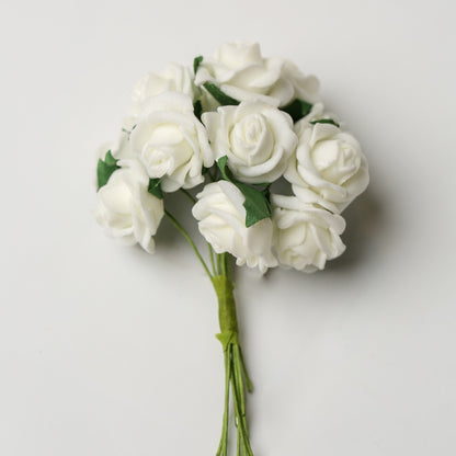 A small bunch of Printable Heaven Small Foam Rose Bunch in Ivory (1″ Wide) featuring ivory foam roses with green leaves and stems.