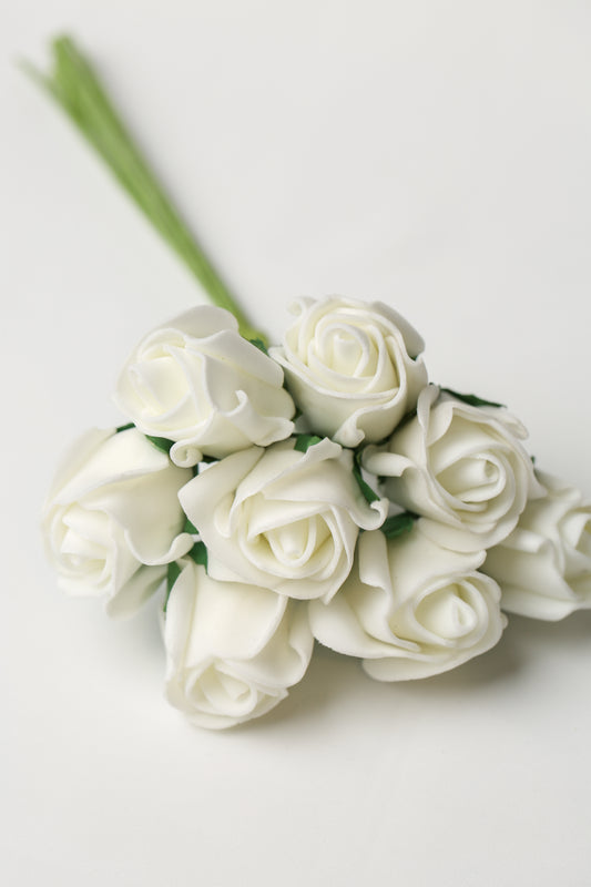 A bunch of Printable Heaven Medium Foam Rose Bunch in Ivory artificial roses on green wire stems.