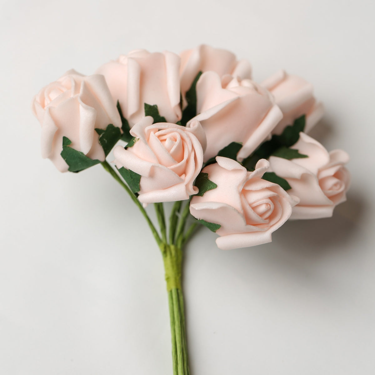 A small bouquet of Printable Heaven Medium Foam Rose Bunch in Light Pink, featuring light pink foam roses with green stems.
