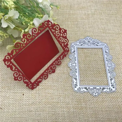 Two ornate rectangular frames, created with the Printable Heaven Ornate Decorative Frame Cutting Die (1 PC) (T048), one in red and one in silver, featuring intricate swirling patterns, are placed on a burlap surface beside white flowers.