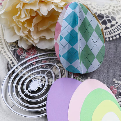 Vibrant Easter paper crafts, featuring paper egg designs created with the Printable Heaven Nesting Eggs with Baby Rabbit Cutting Die (6 PCS) (A097), and a large cream flower are displayed on a lace-trimmed surface adorned with floral patterns.